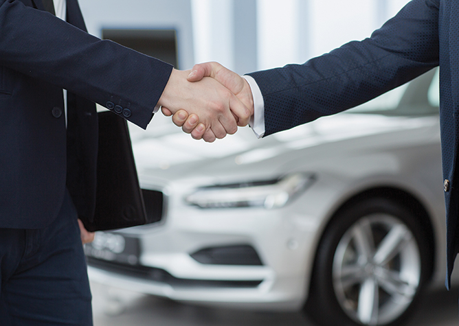automotive people shaking hands