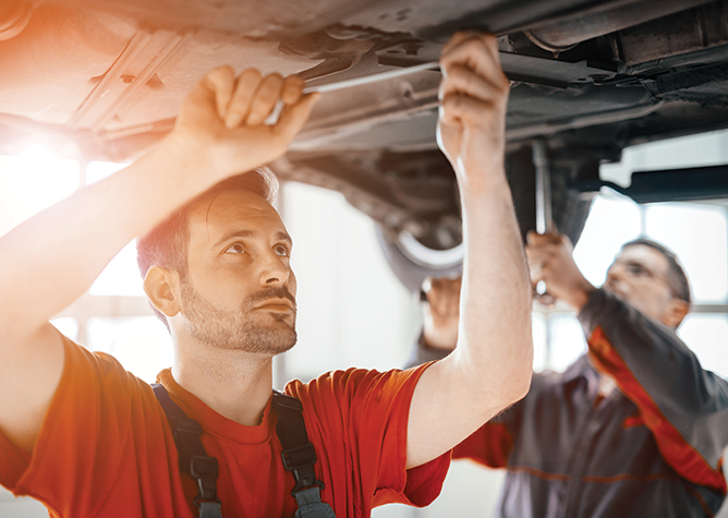 mechanic servicing car