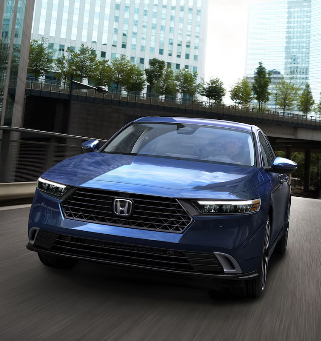 Honda Driving in the Downtown of the City