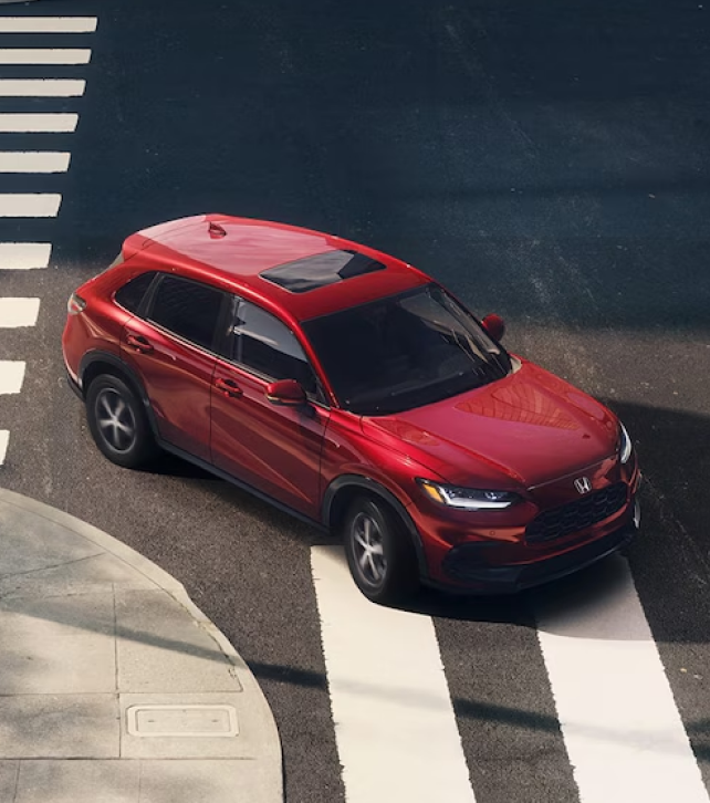 Red Honda turning at an intersection