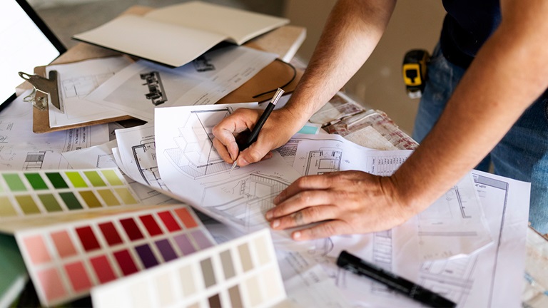 Home remodeling company working on papers