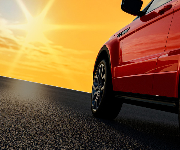 Red car performance driving towards a brighter tomorrow