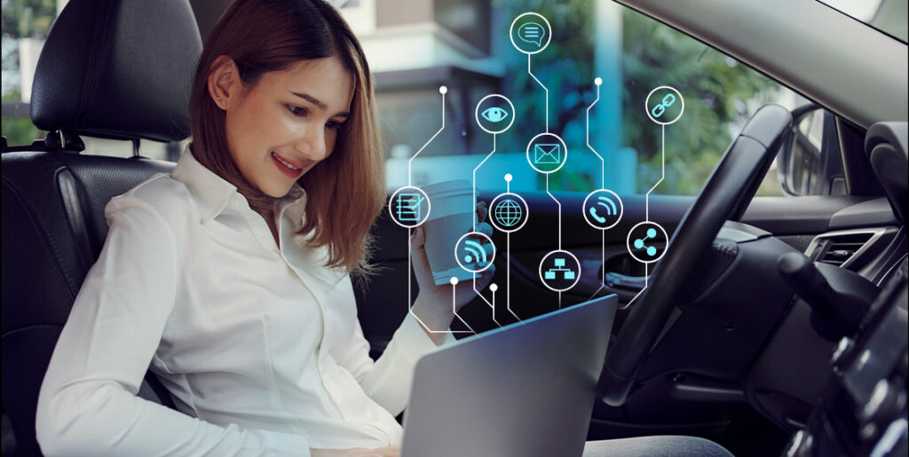 woman on laptop in car