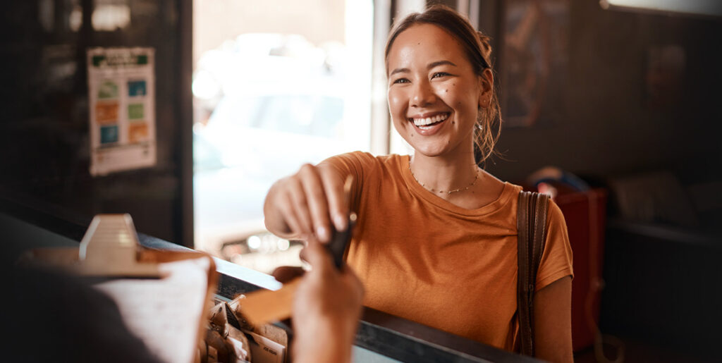 woman handing keys to someone