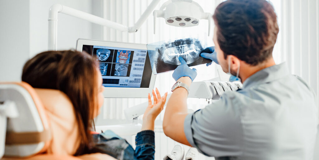 dentist looking at xrays