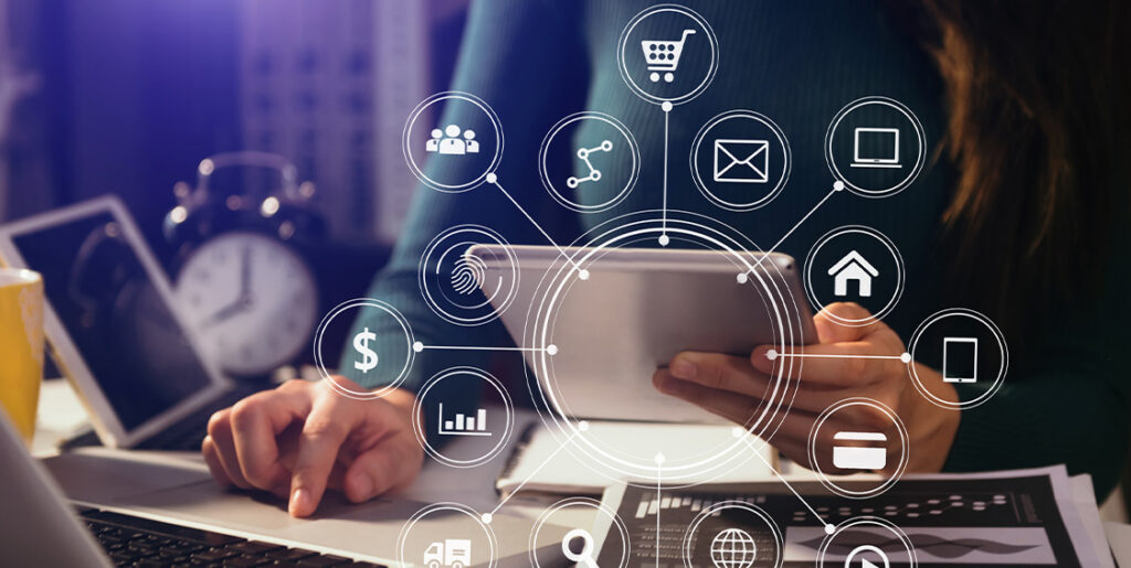 media icons on top of a woman browsing a laptop