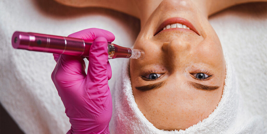 woman smiling receiving facial injections